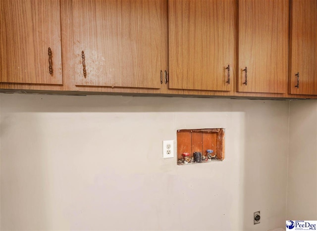 washroom with washer hookup, cabinets, and hookup for an electric dryer