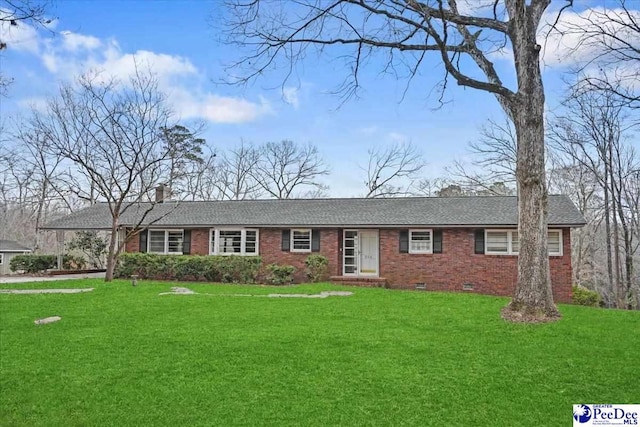 ranch-style home featuring a shingled roof, a chimney, crawl space, a front lawn, and brick siding