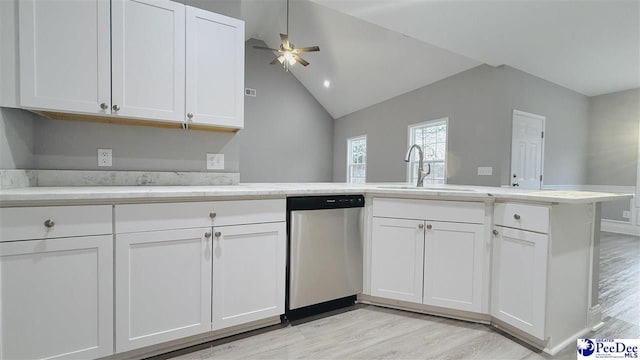 kitchen featuring light wood finished floors, dishwasher, a ceiling fan, a sink, and white cabinetry