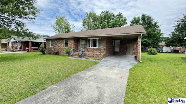1416 Tradd Ct, Florence, SC 29506 - single story home with brick siding, a front lawn, concrete driveway, and an attached carport
