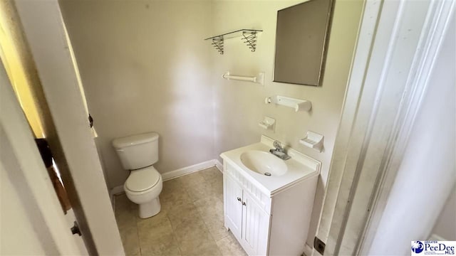 1416 Tradd Ct, Florence, SC 29506 - bathroom featuring toilet, tile patterned floors, vanity, and baseboards