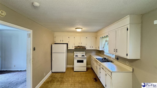 1416 Tradd Ct, Florence, SC 29506 - kitchen with white appliances, a sink, under cabinet range hood, dark flooring, and white cabinets