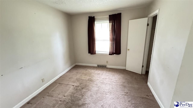 1416 Tradd Ct, Florence, SC 29506 - unfurnished room with carpet, a textured ceiling, and baseboards