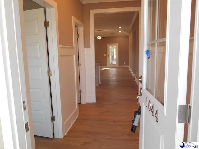 hall with wood-type flooring