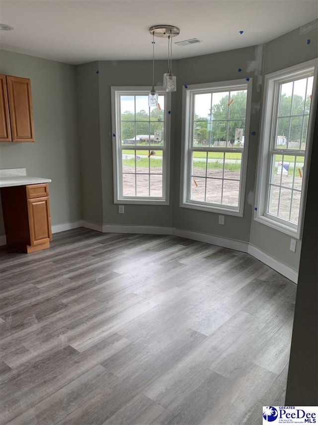 4978 E National Cemetery Rd, Florence, SC 29506 - unfurnished dining area featuring baseboards and wood finished floors