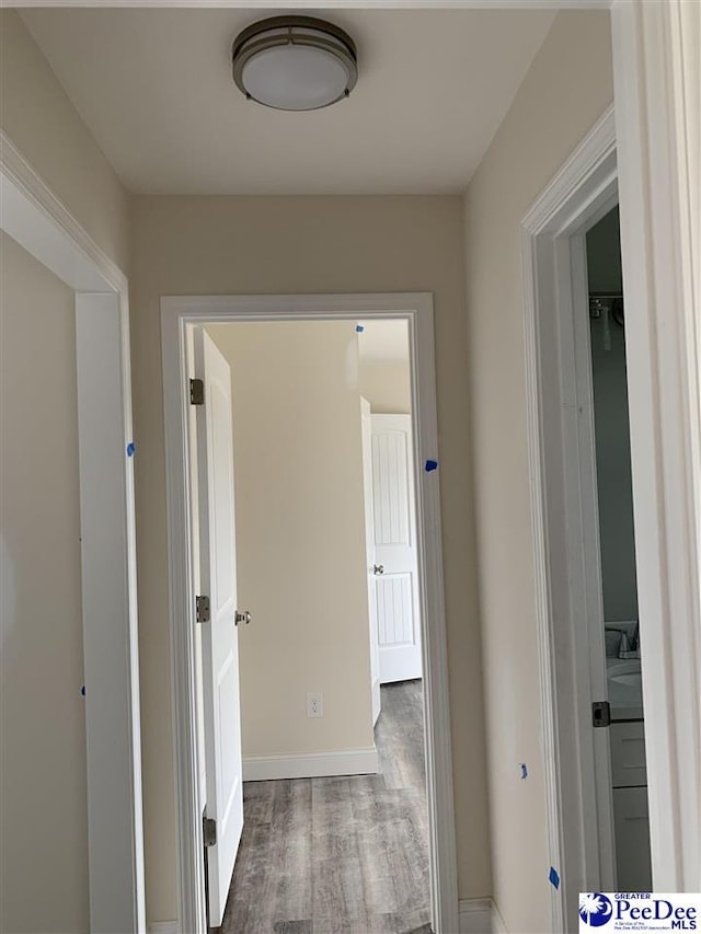 4978 E National Cemetery Rd, Florence, SC 29506 - corridor featuring wood finished floors and baseboards