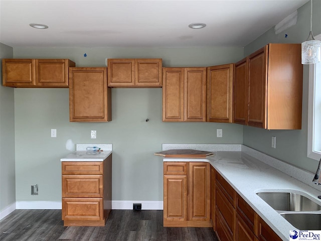 4978 E National Cemetery Rd, Florence, SC 29506 - kitchen with a sink, dark wood-type flooring, brown cabinetry, baseboards, and recessed lighting