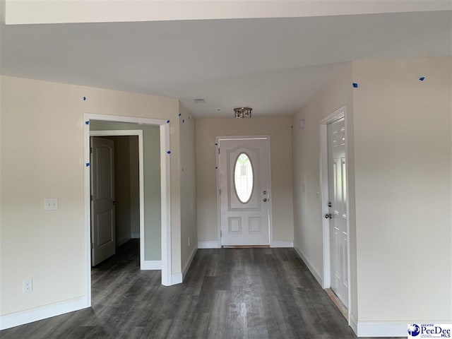 4978 E National Cemetery Rd, Florence, SC 29506 - foyer entrance with dark wood-type flooring and baseboards