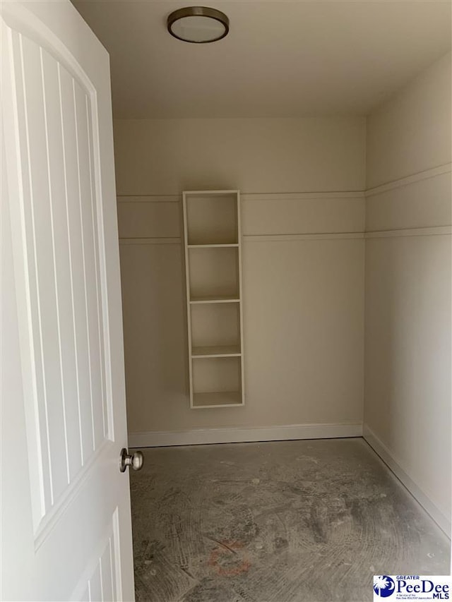 interior space featuring baseboards