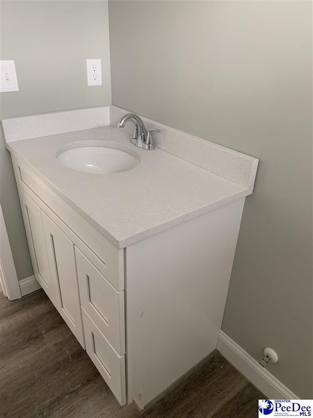 4978 E National Cemetery Rd, Florence, SC 29506 - bathroom featuring wood finished floors and vanity