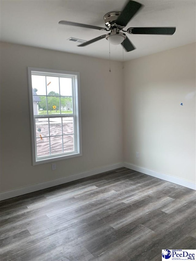 4978 E National Cemetery Rd, Florence, SC 29506 - unfurnished room with ceiling fan, wood finished floors, and baseboards