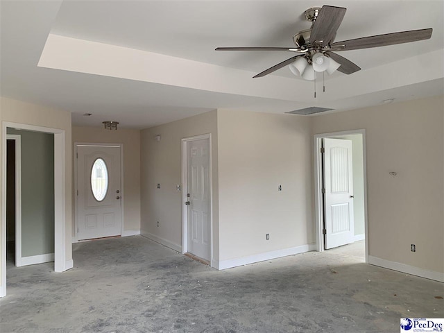 entrance foyer with baseboards and a ceiling fan