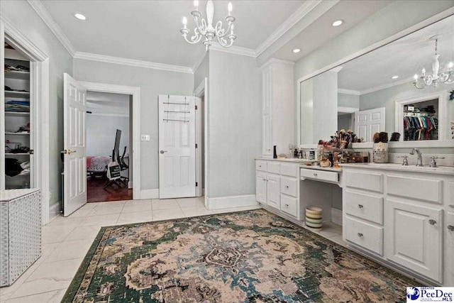 full bathroom featuring double vanity, baseboards, a spacious closet, crown molding, and a chandelier