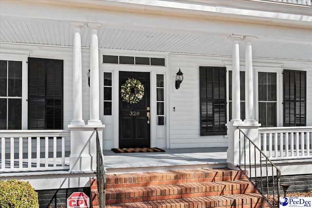 doorway to property with covered porch