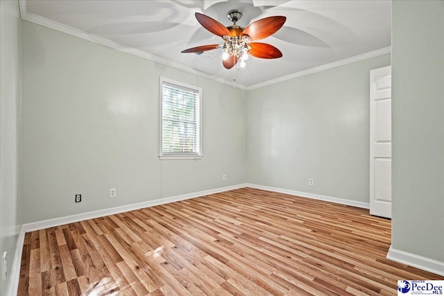 empty room with ornamental molding, light wood finished floors, a ceiling fan, and baseboards