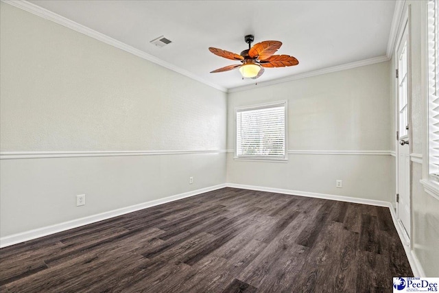 unfurnished room with dark wood-style floors, visible vents, ornamental molding, ceiling fan, and baseboards