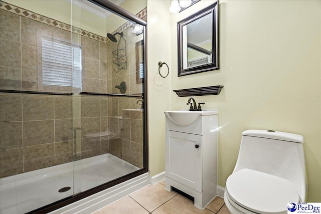 full bathroom featuring vanity, a stall shower, tile patterned flooring, and toilet