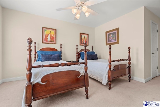 bedroom featuring light carpet, baseboards, and ceiling fan