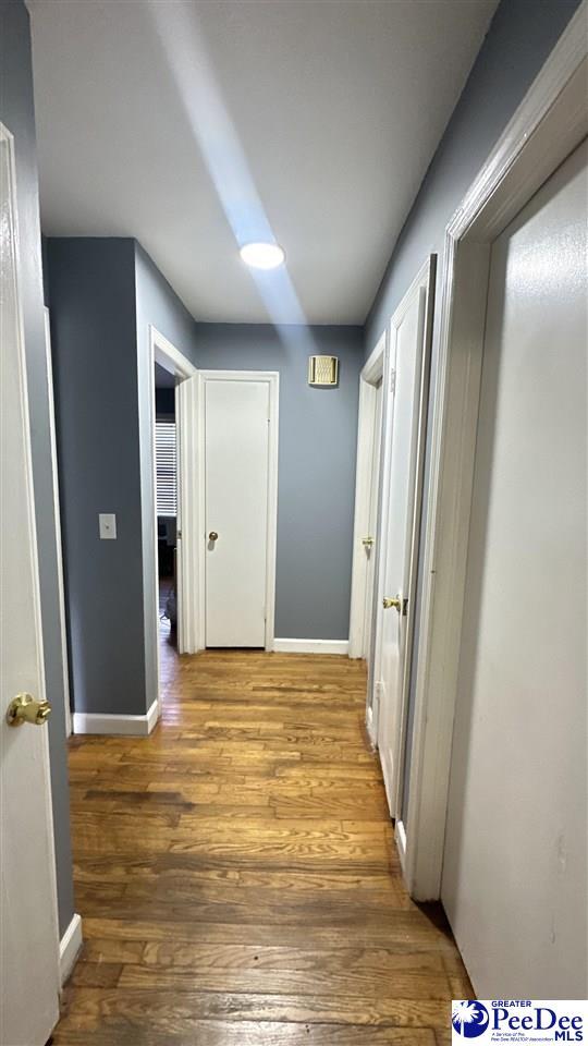 hallway featuring hardwood / wood-style flooring