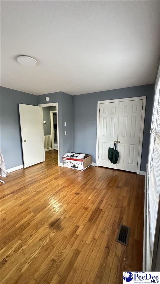 unfurnished room featuring light wood-type flooring