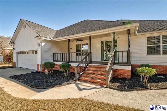 view of front facade with ceiling fan, a porch, and a garage