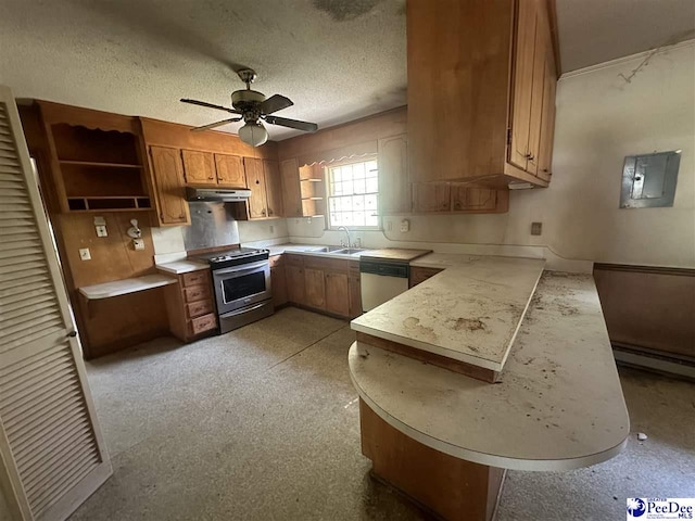 kitchen with sink, ceiling fan, appliances with stainless steel finishes, a baseboard heating unit, and a textured ceiling