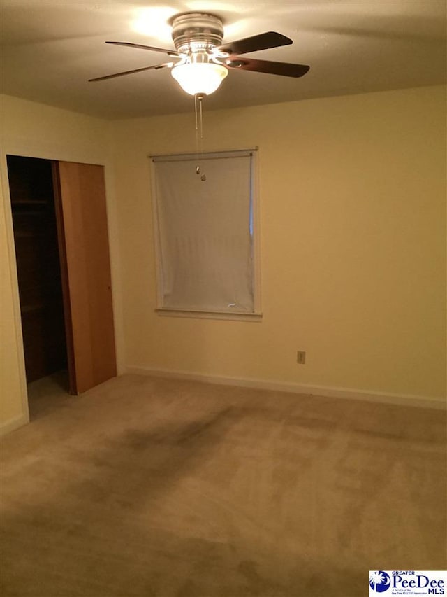 429 S Wallace Rd, Florence, SC 29506 - unfurnished bedroom featuring carpet floors, ceiling fan, and a closet