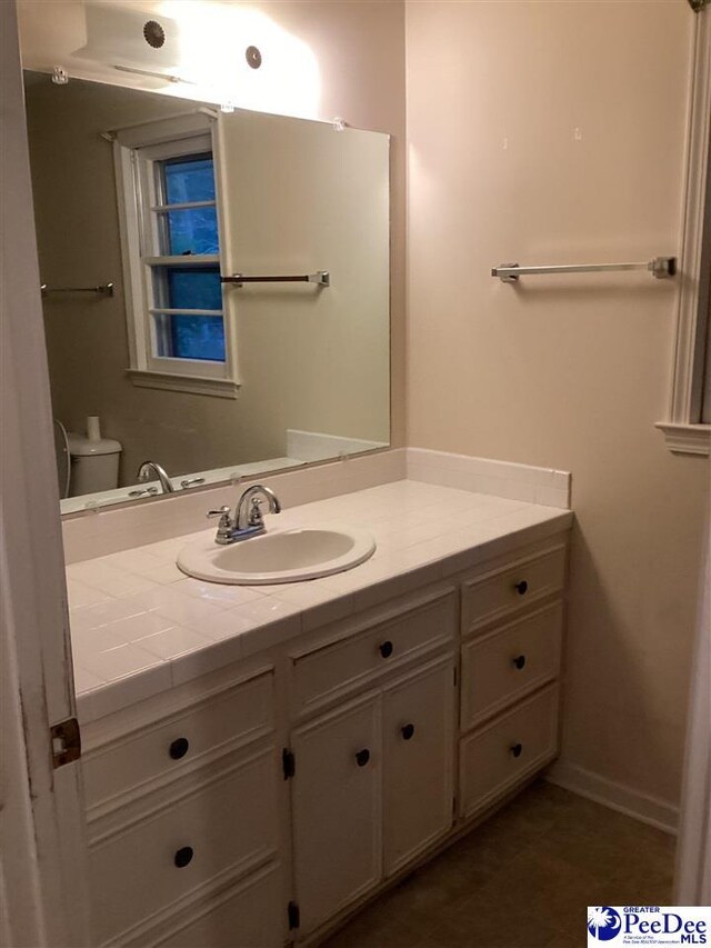 429 S Wallace Rd, Florence, SC 29506 - bathroom with vanity and toilet