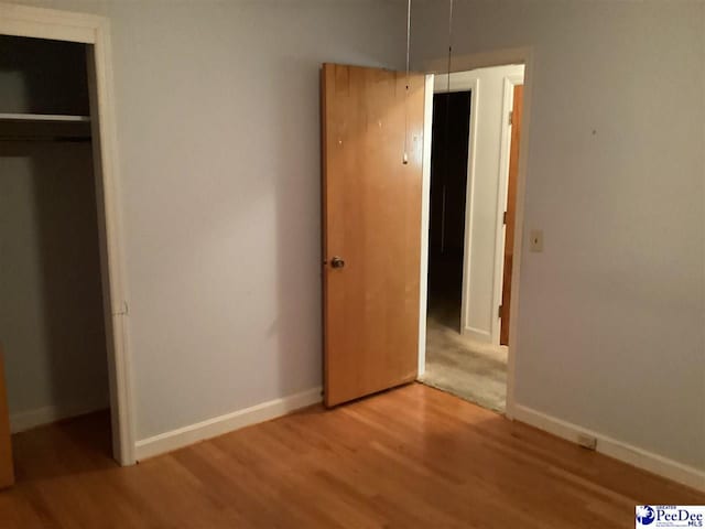 429 S Wallace Rd, Florence, SC 29506 - unfurnished bedroom with hardwood / wood-style floors