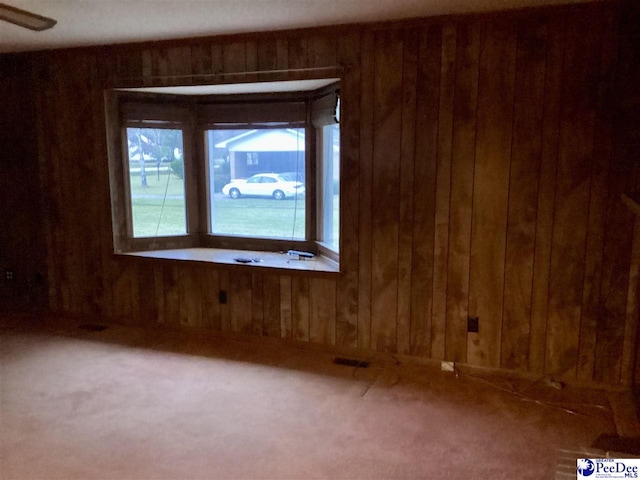 429 S Wallace Rd, Florence, SC 29506 - carpeted spare room with wooden walls