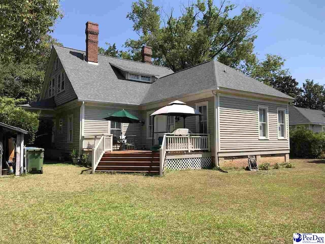 back of house featuring a gazebo, a lawn, and a deck