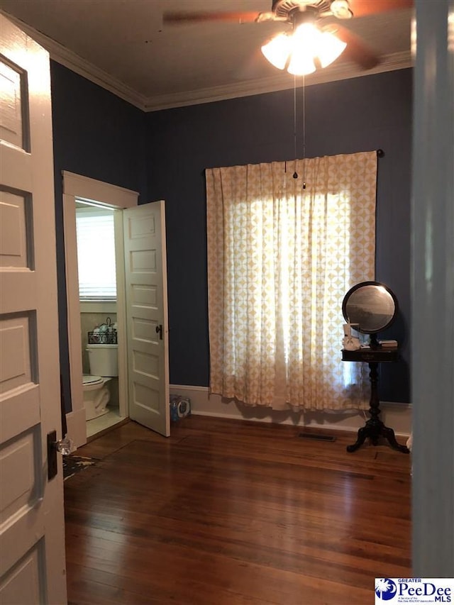 dining space with ornamental molding, dark hardwood / wood-style floors, and ceiling fan