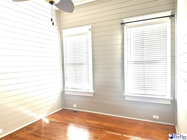 unfurnished room featuring dark wood-type flooring