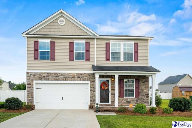 craftsman-style home with a garage and a front yard