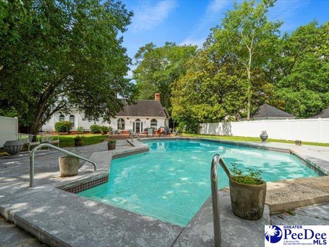 view of pool featuring a patio and an outdoor structure