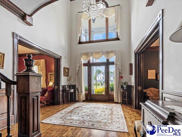 foyer featuring an inviting chandelier and light wood-type flooring