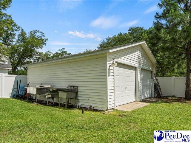 garage featuring a yard