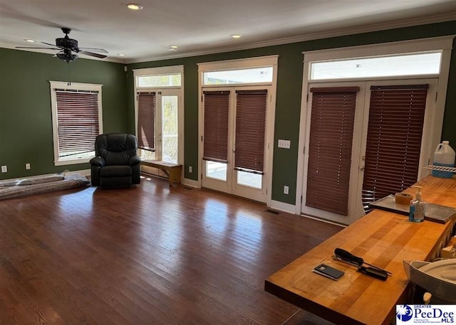 interior space featuring french doors, recessed lighting, ornamental molding, wood finished floors, and baseboards