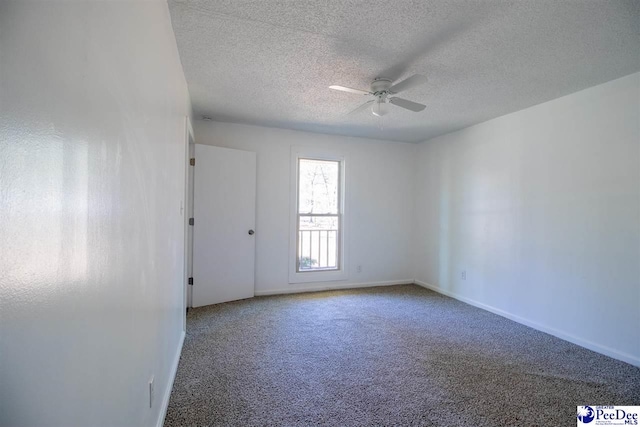 unfurnished room with baseboards, a textured ceiling, a ceiling fan, and carpet flooring