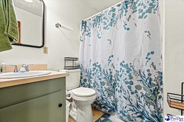 full bathroom with toilet, tile patterned floors, a shower with shower curtain, and vanity