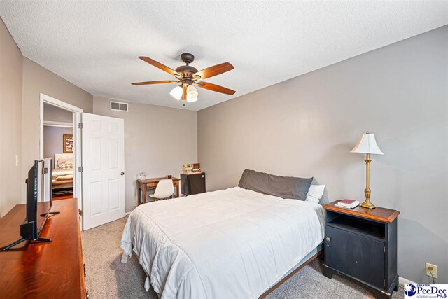 500UNIT31 Woodland, Florence, SC 29501 - carpeted bedroom with a ceiling fan and a textured ceiling