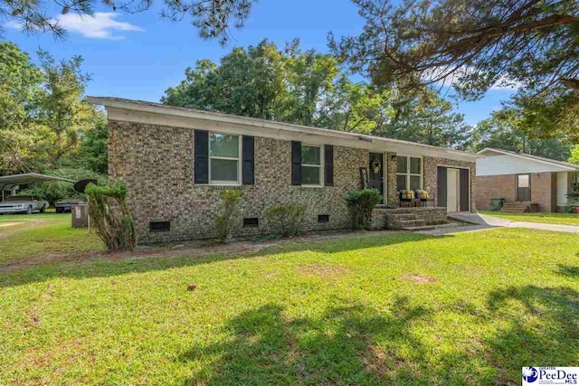 ranch-style home with a front lawn