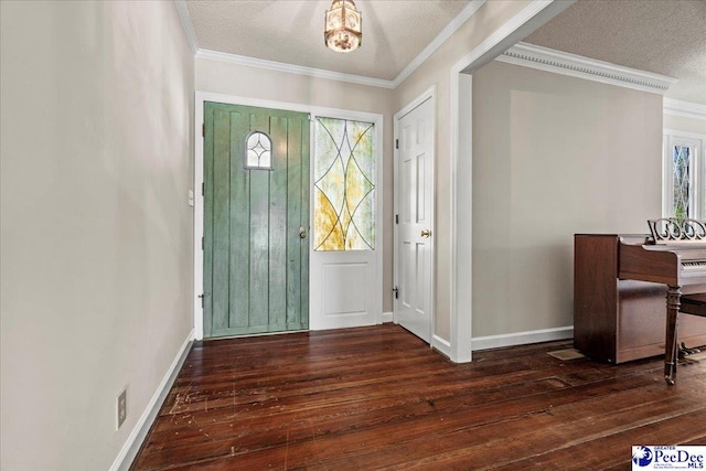 entryway featuring ornamental molding, wood-type flooring, and a textured ceiling