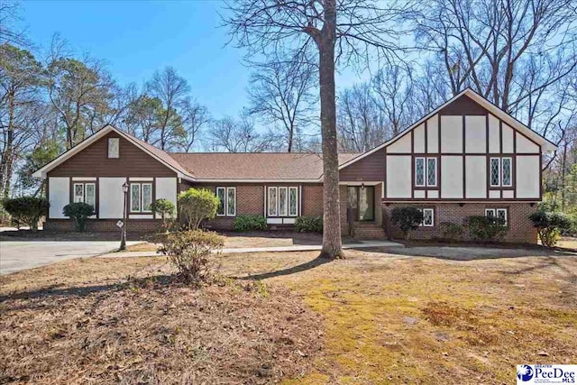 view of front of house featuring brick siding