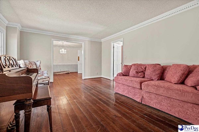 living room featuring a textured ceiling, hardwood / wood-style floors, and crown molding