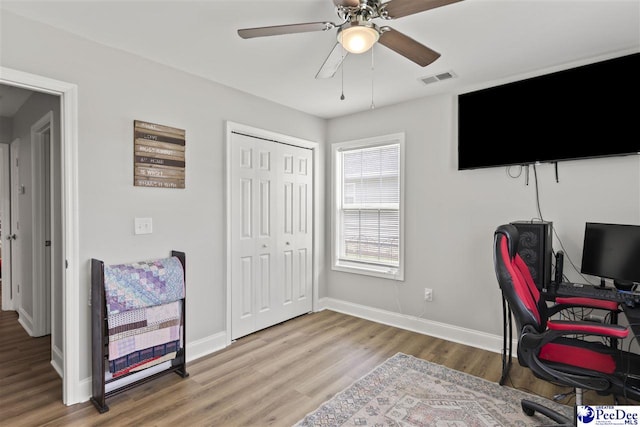 515 Young St, Darlington, SC 29532 - home office featuring wood finished floors, baseboards, and ceiling fan