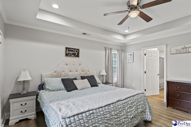 515 Young St, Darlington, SC 29532 - bedroom with a raised ceiling, wood finished floors, recessed lighting, crown molding, and a ceiling fan