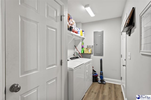 515 Young St, Darlington, SC 29532 - laundry room with electric panel, light wood finished floors, separate washer and dryer, and baseboards