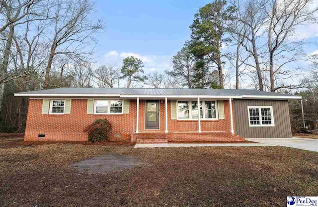 ranch-style house featuring crawl space, driveway, and brick siding