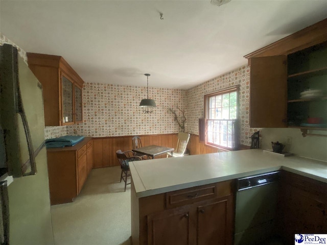 112 Williamson Pl, Darlington, SC 29532 - kitchen with dishwashing machine, a peninsula, glass insert cabinets, brown cabinetry, and freestanding refrigerator
